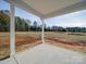 Covered porch overlooking a spacious backyard at 2335 Emanuel Church Rd, Rockwell, NC 28138
