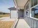Covered porch with gray siding and brick base at 2335 Emanuel Church Rd, Rockwell, NC 28138