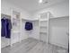 Spacious walk-in closet with built-in shelving and hanging rods at 2335 Emanuel Church Rd, Rockwell, NC 28138