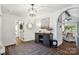 Bright entryway with hardwood floors, a dark cabinet, and view to living room at 4080 Point Clear Dr, Tega Cay, SC 29708