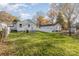 Large backyard with grassy area and neighboring houses at 429 Dare Dr, Charlotte, NC 28206
