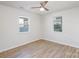 Bright bedroom featuring hardwood floors and two large windows at 429 Dare Dr, Charlotte, NC 28206