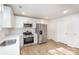 Modern kitchen with white shaker cabinets, stainless steel appliances, and quartz countertops at 429 Dare Dr, Charlotte, NC 28206