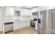 Modern kitchen with white shaker cabinets, stainless steel appliances, and quartz countertops at 429 Dare Dr, Charlotte, NC 28206