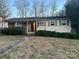 Single story home with brick facade and landscaped yard at 5745 Southampton Rd, Charlotte, NC 28217