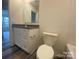 Bathroom with white vanity, granite countertop, and a view of the outdoors at 104 Salem Springs Ln, Statesville, NC 28625