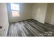 Cozy bedroom with natural light and wood flooring at 104 Salem Springs Ln, Statesville, NC 28625