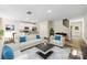 Cozy living room with an open floor plan, modern furniture, and hardwood flooring at 104 Salem Springs Ln, Statesville, NC 28625