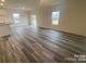 Bright living room with hardwood floors and plenty of natural light at 104 Salem Springs Ln, Statesville, NC 28625