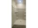 Clean white shower stall with built in shelving for storage at 104 Salem Springs Ln, Statesville, NC 28625