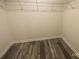 Spacious walk-in closet featuring shelving and wood flooring at 104 Salem Springs Ln, Statesville, NC 28625