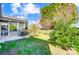 Spacious, grassy yard with mature trees and a patio for outdoor dining at 2221 Hartwell Ln, Fort Mill, SC 29707