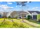 Charming home featuring a well-manicured lawn with mature trees at 2221 Hartwell Ln, Fort Mill, SC 29707