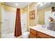 Full bathroom with tub-shower, framed art, and single-sink vanity offers a comfortable bathing experience at 2221 Hartwell Ln, Fort Mill, SC 29707