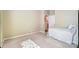 Cozy bedroom featuring neutral carpet and patterned bedding at 2221 Hartwell Ln, Fort Mill, SC 29707