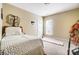 Cozy bedroom with carpet, a window, and a decorative tree on the wall at 2221 Hartwell Ln, Fort Mill, SC 29707