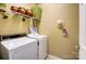 Convenient laundry room equipped with washer, dryer, and ample storage space at 2221 Hartwell Ln, Fort Mill, SC 29707