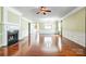 Large living room with fireplace, hardwood floors, and natural light at 2221 Hartwell Ln, Fort Mill, SC 29707