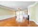 Spacious living room with fireplace, hardwood floors, and open floor plan at 2221 Hartwell Ln, Fort Mill, SC 29707