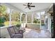 Inviting screened-in porch with wicker furniture offering peaceful outdoor living at 2221 Hartwell Ln, Fort Mill, SC 29707