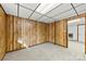 Finished basement features wood-paneled walls and a doorway with trim at 5034 Clearwater Lake Rd, Mount Holly, NC 28120