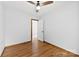 A cozy bedroom with hardwood floors and a ceiling fan at 5034 Clearwater Lake Rd, Mount Holly, NC 28120