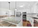 Modern kitchen featuring granite counters, white cabinets and stainless steel appliances at 5034 Clearwater Lake Rd, Mount Holly, NC 28120