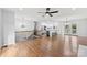 Open-concept living space with stairs and a modern kitchen island at 5034 Clearwater Lake Rd, Mount Holly, NC 28120