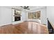 Cozy living room with a fireplace and a bay window at 5034 Clearwater Lake Rd, Mount Holly, NC 28120