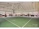 Full, covered basketball court provides weather protection for year round sporting activities in the community at 913 Deep River Way, Waxhaw, NC 28173