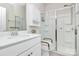 This bathroom offers a convenient grab bar and shower, complemented by a crisp, clean aesthetic at 913 Deep River Way, Waxhaw, NC 28173