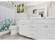 The bathroom features a double sink vanity, with a large mirror and plenty of storage space at 913 Deep River Way, Waxhaw, NC 28173