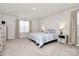 Well-lit bedroom with carpeted floors, bedside lamps, a comfy bed, and matching dressers at 913 Deep River Way, Waxhaw, NC 28173