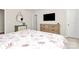 This bedroom features stylish furnishings, a modern dresser, and a well-lit space at 913 Deep River Way, Waxhaw, NC 28173