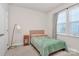 Bright bedroom featuring a cozy bed with warm blanket, and natural light from the window at 913 Deep River Way, Waxhaw, NC 28173