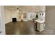 Bright and airy open-concept living space with a fireplace, kitchen island, and dining area at 913 Deep River Way, Waxhaw, NC 28173