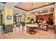 Community clubhouse lobby with elegant chandelier, seating area, and community information at 913 Deep River Way, Waxhaw, NC 28173