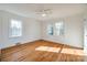 Well-lit bedroom featuring hardwood floors and neutral walls at 1081 Evergreen Cir, Rock Hill, SC 29732