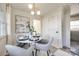 Bright breakfast nook with white table and four gray chairs at 1081 Evergreen Cir, Rock Hill, SC 29732