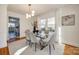 Modern dining room features glass table, gray chairs, and a view into the kitchen at 1081 Evergreen Cir, Rock Hill, SC 29732