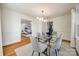 Bright dining room with glass table and seating for six, hardwood floors, and view of living room at 1081 Evergreen Cir, Rock Hill, SC 29732