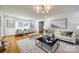 Living room with hardwood floors, large windows and comfortable seating at 1081 Evergreen Cir, Rock Hill, SC 29732