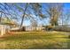 Large backyard with shed, fire pit, and hammock at 128 Hugh Caldwell Rd, Charlotte, NC 28214