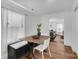 Small dining area with a wooden table and built-in bench seating at 128 Hugh Caldwell Rd, Charlotte, NC 28214