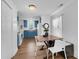 Modern kitchen with blue cabinets and a wooden dining table at 128 Hugh Caldwell Rd, Charlotte, NC 28214