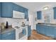 Updated kitchen featuring blue cabinets and new appliances at 128 Hugh Caldwell Rd, Charlotte, NC 28214