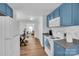 Renovated kitchen with blue cabinets and modern appliances at 128 Hugh Caldwell Rd, Charlotte, NC 28214