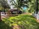 Expansive green backyard with stone patio and outdoor entertaining space, perfect for outdoor activities at 13538 Pine Harbor Rd, Charlotte, NC 28278