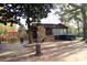 Spacious backyard with an outdoor kitchen, dining area, and a relaxing hot tub at 13538 Pine Harbor Rd, Charlotte, NC 28278