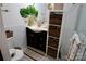 Charming bathroom featuring stylish vanity, elegant mirror, and practical wicker basket storage at 13538 Pine Harbor Rd, Charlotte, NC 28278